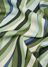 Linen rectangular tablecloth with an organic, undulating pattern in blue, green and ivory hues.
